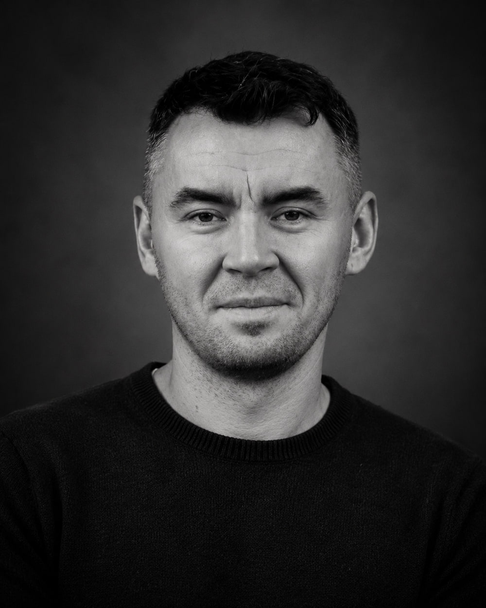 Black and white studio portrait of Laszlo Kiss